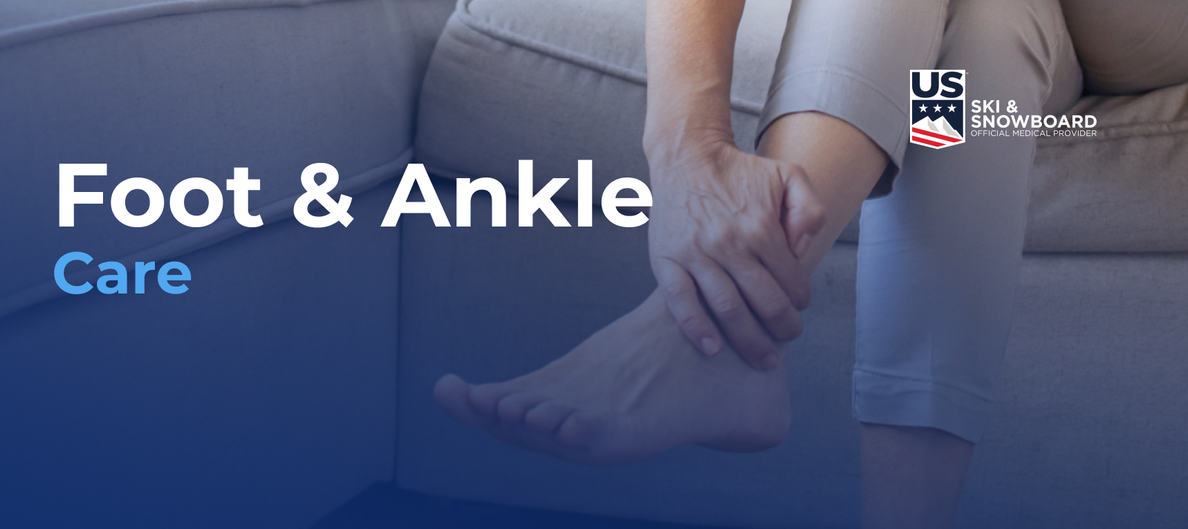 Person sitting on a sofa holding their left foot. Text overlay reads "Foot & Ankle Care" with a US Ski & Snowboard logo.