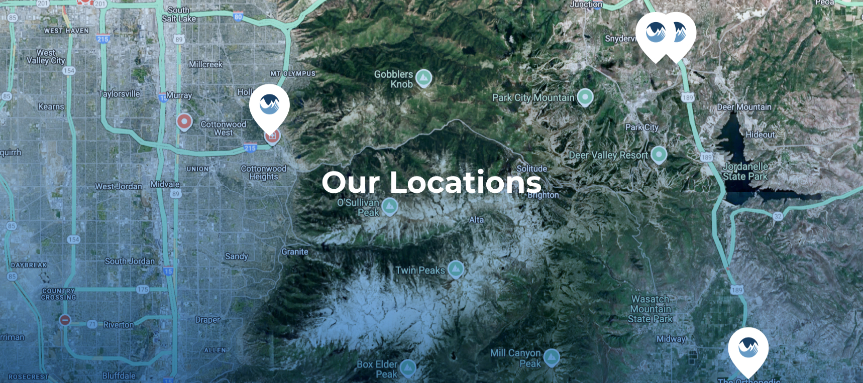 Terrain aerial view of a map indicating the 4 main locations of The Orthopedic Partners clinics and with text that reads "Our Locations".